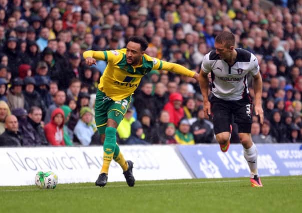 Norwich City's Nathan Redmond is  challenged by Rotherham's Joe Skarz.