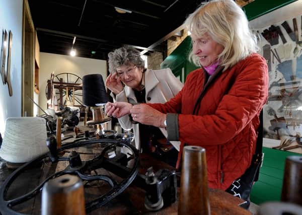 Sheila Barrass, 75, from Saddleworth, and Diana Runsom, 65, from Simonstone, take an interest in items that were used for weaving