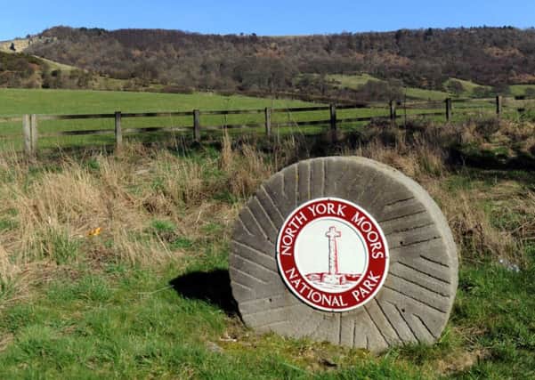 A North York Moors National park sign at the foot of Sutton Bank