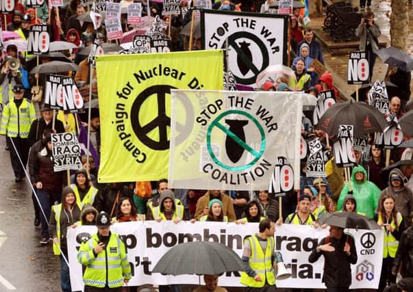 Saturday's anti-war march protesting against the UK military involvement in the middle east, makes its way along the Embankment in London.
