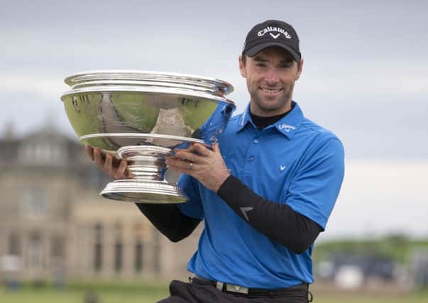 Oliver Wilson celebrates winning the Alfred Dunhill Links Championship at St Andrews.