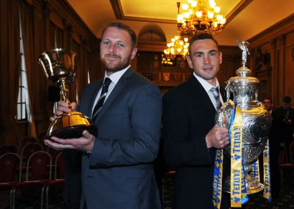 Yorkshire CCC captain Andrew Gale, left, holds the County Championship trophy and Kevin Sinfield, captain of Leeds Rhinos rugby league team, the Challenge Cup trophy at last nights reception held to honour the two teams, at Civic Hall, Leeds (Picture: Simon Hulme).