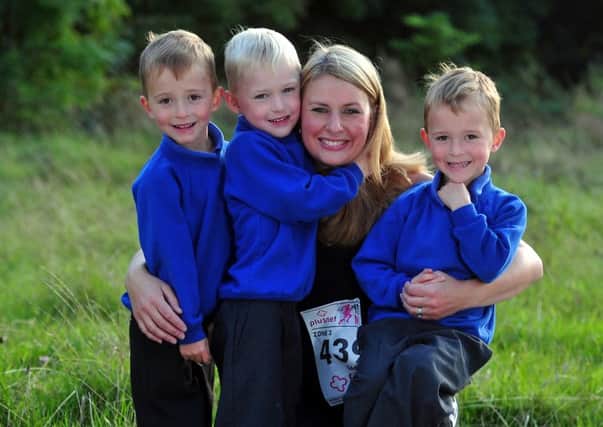 Sara Abbott is running the Yorkshire Marathon for the special baby care unit at Airedale Hospital, pictured with her triplets George, James and Fraser