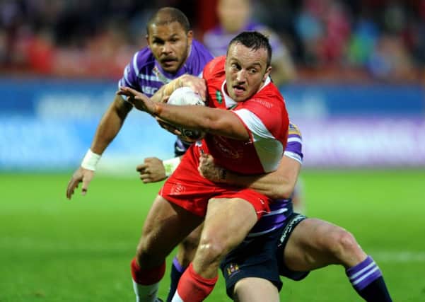 England team-mates: Rovers' Josh Hodgson is tackled by Wigan's Matthew Smith.