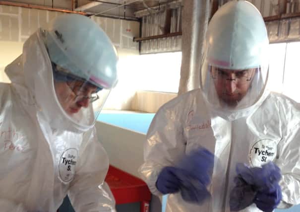Dr. Michael OConnor and Dr. Mark Nunnally during Ebola preparedness training at the University of Chicago.