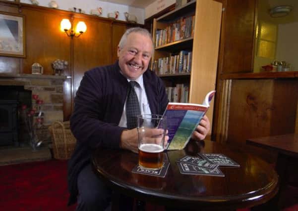 Paul Cullen in the library area of the George and Dragon community pub in Hudswell near Richmond