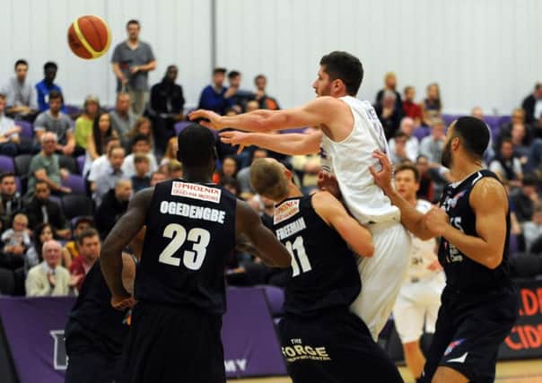 Zak Wells passes under pressure for Leeds Force. Picture: Steve Riding.