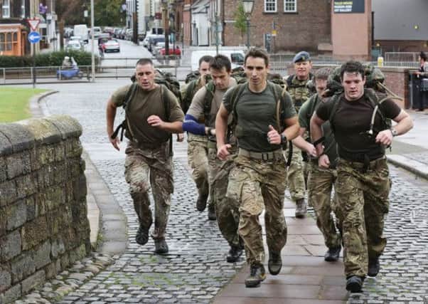 Personnel from RAF Leeming endured heat, cold, blisters and aching backs to race the length of Hadrians Wall in just four days. Picture: RAF Leeming