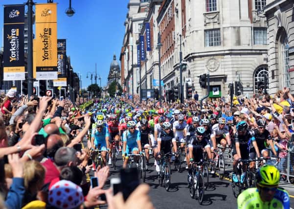 Mark Cavendish leads cyclists down the Headrow at the start of the Tour De France. Picture by Simon Hulme.