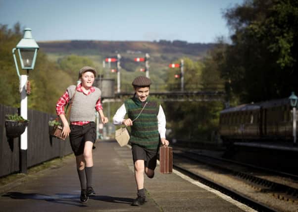 'Evacuees' Danni Edwards, 13, and Sam Nichols, 11, on the platform at Grosmont Station. Picture: Ross Parry Agency