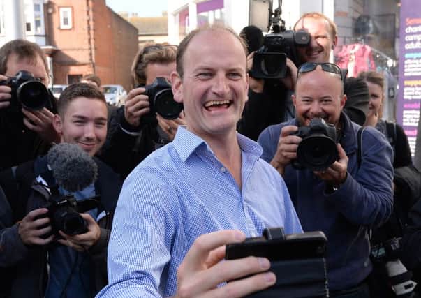 Newly elected UKIP MP for Clacton-on-Sea in Essex Douglas Carswell celebrates after winning last night's by-election, which was forced after he defected from the Conservative Party.