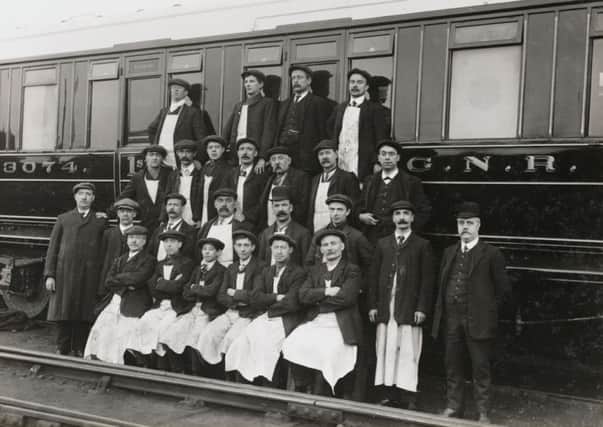 Railway workers beside a carriage, South Yorkshire, c 1916.