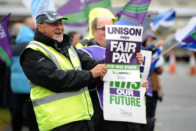 Hundreds of thousands of health workers have walked out on strike, many for the first time in their lives, in protest at the Government's decision not to give them a recommended pay rise.