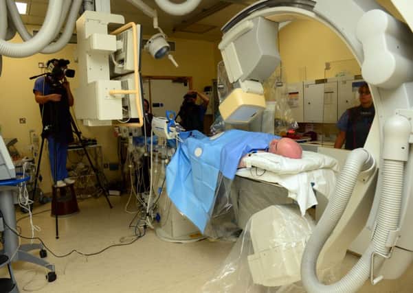 13 Oct 2014.....Consultant Dr Ever Grech and his team perform. a procedure during a live Cath-Lab demonstration at the Northern General Hospital in Sheffield. Picture Scott Merrylees SM1005/44e