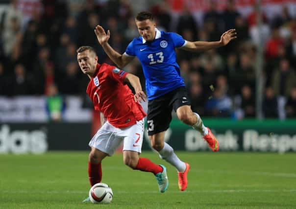 ADAPTING TO FIT: Midfielder Jack Wilshere, left, is comfortable with the role he is asked to perform by England coach Roy Hodgson.