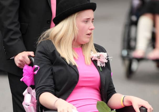 Amy Firth in a wheelchair at the funeral of her sister Bethany Jones. Picture: Ross Parry Agency