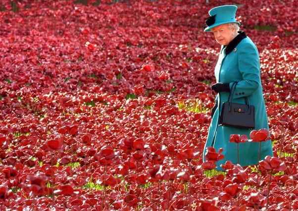 The Queen during a visit to the Tower of London's Blood Swept Lands and Seas of Red installation.