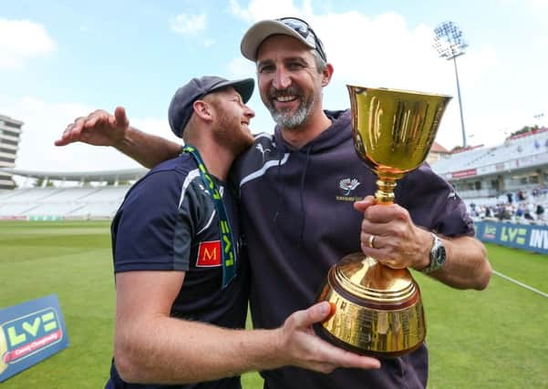 Yorkshire captain Andrew Gale and First Team Coach Jason Gillespie celebrate with the trophy.