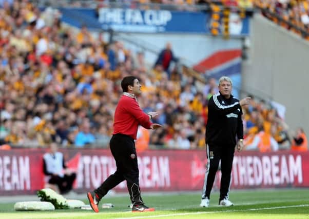 Sheffield United manager Nigel Clough with Hull's Steve Bruce at Wembley in the FA Cup semi-final earlier this year.