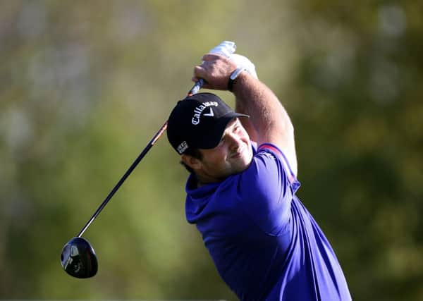 Patrick Reed tees off during his match against Jamie Donaldson