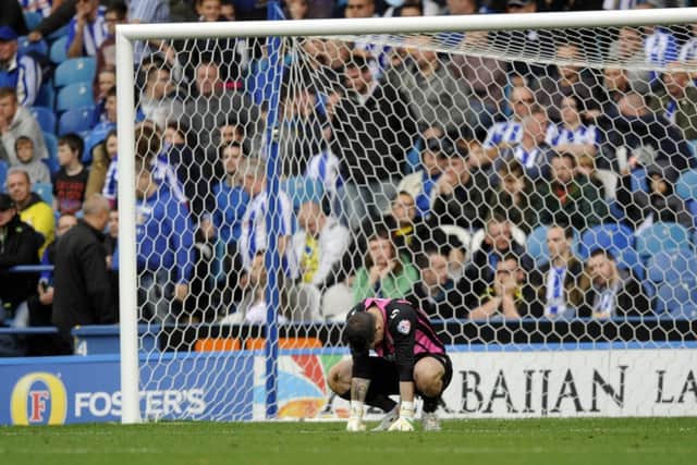 Sheffield Wednesday goalkeeper Kieren Westwood despairs after his mistake led to Watford's third goal (Picture: Steve Ellis).