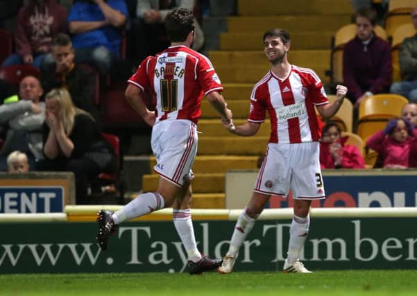 Bob Harris, right, celebrates his and Sheffield United's first goal against Bradford City. Picture: Martyn Harrison.