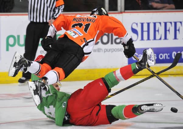 Sheffield Steelers' Tyler Mosienko tries to avoid a direct collision with a Cardiff defenceman. Picture: Dean Woolley.