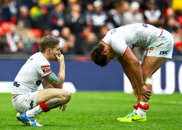 Englands Sam Tomkins, left, and Sean OLoughlin are dejected after last Novembers heart-breaking loss to New Zealand in the World Cup semi-fina (Picture: Alex Whitehead/SWPIX.com).