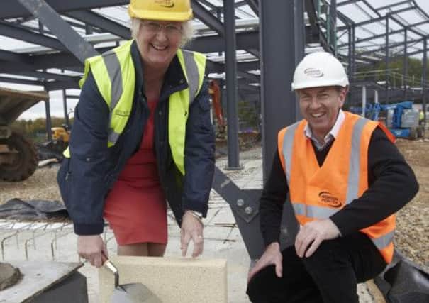 The first bricks of the new Riseholme College campus being laid by Jeanette Dawson, of Bishop Burton College, and Dave Blades, of Hobson & Porter.