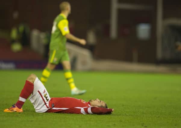 BAD NIGHT: Ryan Williams can't believe Barnsley let a 2-0 lead disappear. Picture: Dean Atkins.