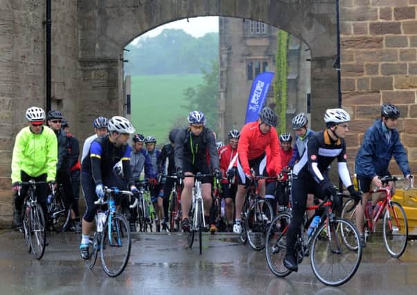 Cyclists set off in torrential rain from Ripley Castle earlier this year.           Picture: Gary Longbottom