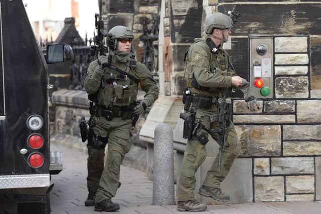A soldier standing guard at Canada's National War Memorial has been shot by an unknown gunman and there have been reports of gunfire inside the halls of Parliament.