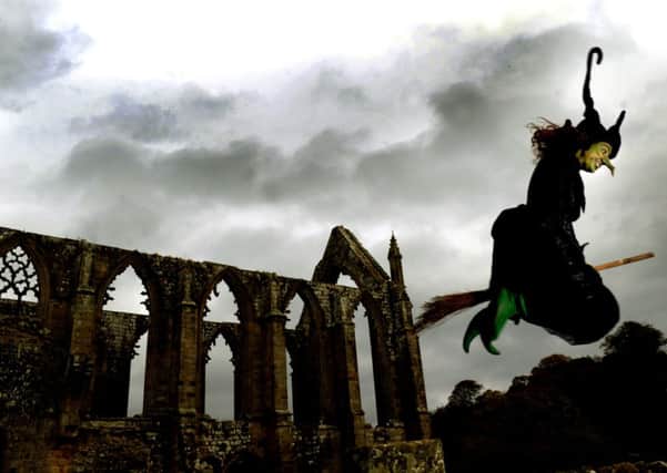 Sarah-Jane Stapleton from Bolton Abbey dressed as a witch 'flying' past the Priory getting ready for Halloween events on the Bolton Abbey estate.  PIC: Gary Longbottom