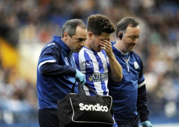 A visibly upset Sam Hutchinson leaves the field injured against Watford on Saturday.