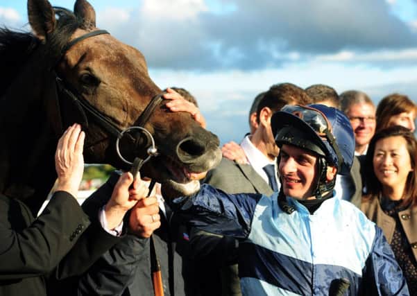 Jockey Andrea Atzeni celebrates with Kingston Hill after winning the Racing Post Trophy at Doncaster last year (Picture: Anna Gowthorpe/PA Wire).