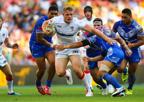 Tom Burgess tries to drive forward against Samoa in Brisbane. Pictures: Photosport/SWpix.