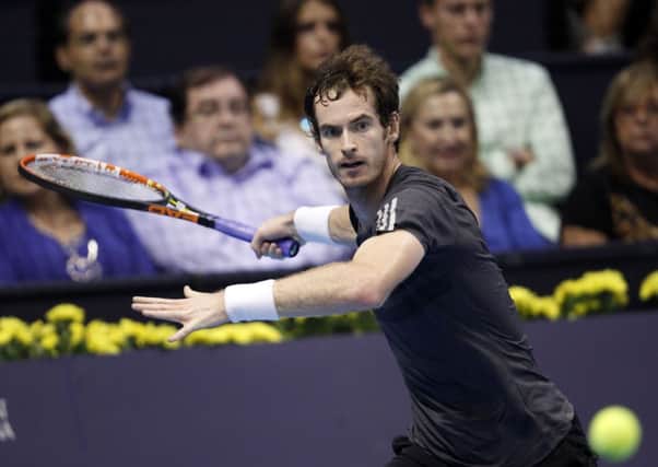 Andy Murray on his way to victory in the final of the Valencia Open against Tommy Robredo. Picture: AP/Alberto Saiz.