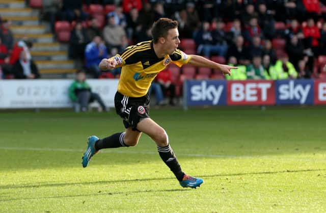 HERO: Stefan Scougall celebrates his winning goal for Sheffield United against Crewe. Picture: Martyn Harrison
