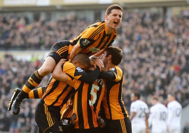 Alex Bruce jumps to celebrate James Chesters goal against Manchester United last season (Picture: Getty Images).