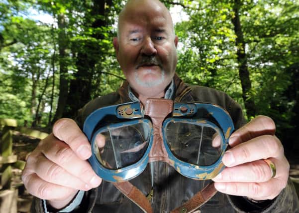 David Harvey with goggles that belonged to one of the airmen. Picture by Simon Hulme