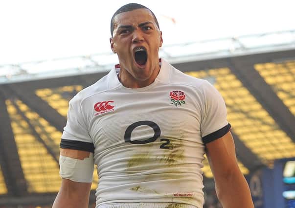 England's Luther Burrell celebrates scoring a try during the RBS Six Nations match at Twickenham, London.