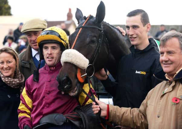 NO RETURN: Jockey Jason Maguire with Harry Topper after winning last year's Charlie Hall Chase at Wetherby. Picture: Bruce Rollinson
