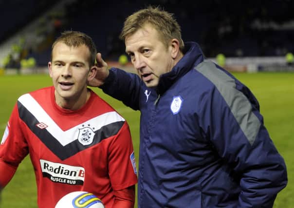 WELL DONE SON: Sheffield Wednesday goalkeeping coach Andy Rhodes with son Jordan who scored four times for Huddersfield Town to secure a 4-4 draw in 2011.
