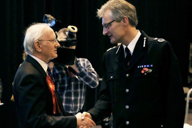 Labour Party candidate Alan Billings shakes hands with David Crompton, South Yorkshire Chief Constable (right)