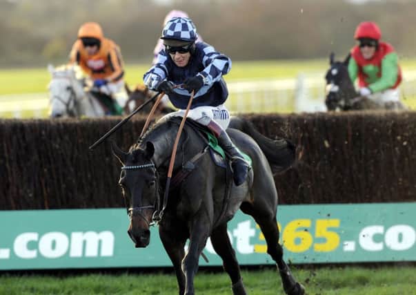 Menorah and Richard Johnson jump the last fence as they go on and win the bet365 Charlie Hall Chase during the Charlie Hall Chase day at Wetherby Racecourse. Picture: John Giles/PA Wire