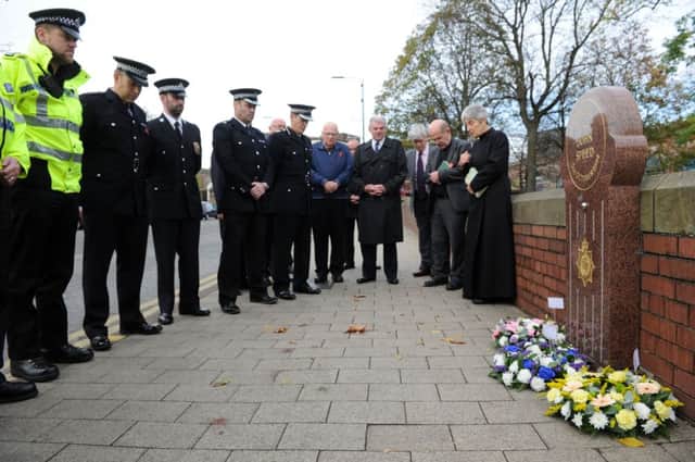 Sgt Chris Bentley, Chief Supt Paul Money and  Asst Chief Constable Mark Milsom who laid wreaths during a short service in memory of Sgt John Speed who was murdered outside Leeds Minster 30 years ago