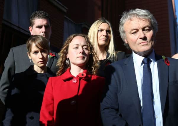 Emma, Kelly  and Don Maguire, listen to a statement being read out after they left  Leeds Crown Court
