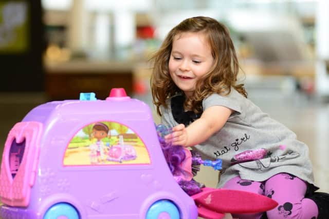 Three year-old Eva Frost with a 'Doc Mc Stuffins Get Better Talking Mobile'