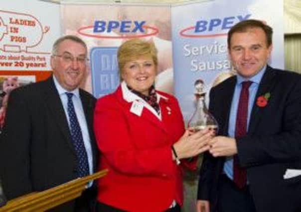 From left, Stewart Houston, chairman of BPEX, Sue Woodall, chairman of Ladies in Pigs, and Farming Minister George Eustice.