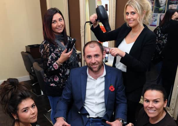 Halifax Town goalkeeper Matt Glennon pictured at his business, where hi day job is a barber. Pictured with from left, Danielle Jagger, Laura MacLeod, Jo Linsley and wife Nicola.
 (Picture: Jonathan Gawthorpe).